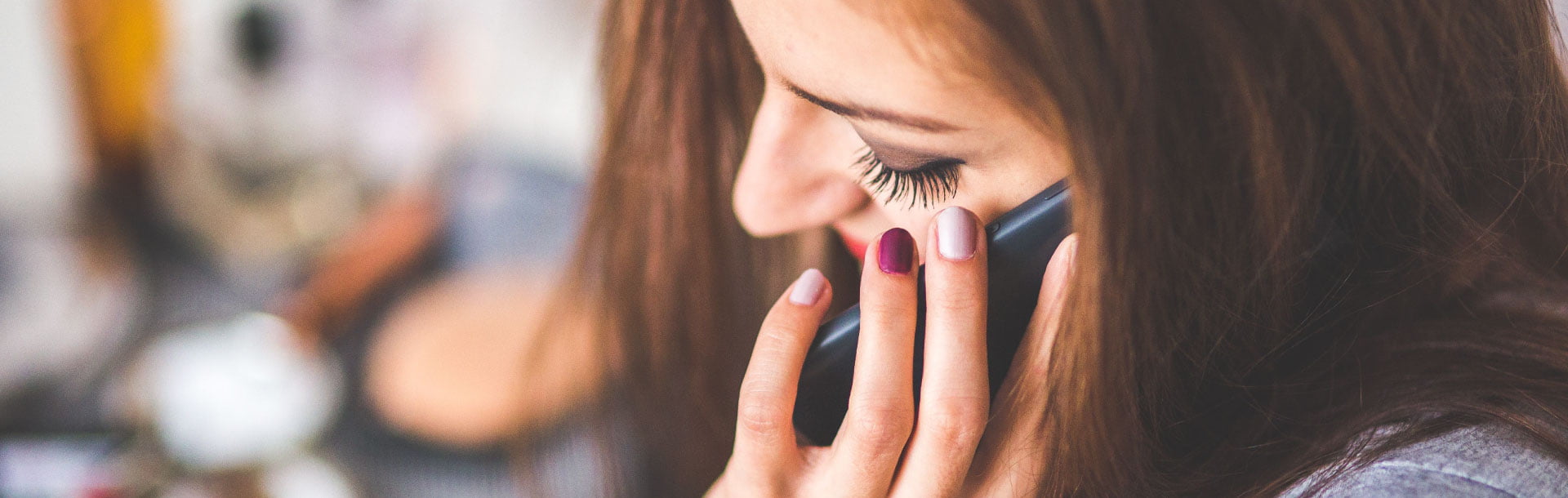 Woman using a phone as contact page